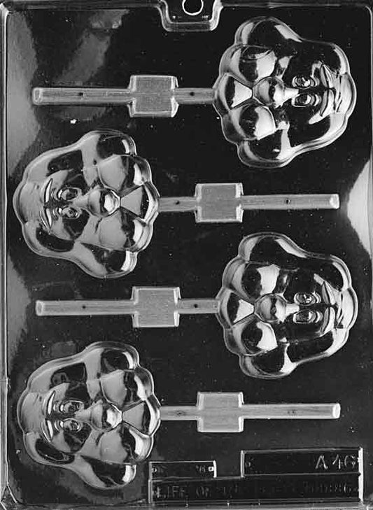 Lollipop cavities shaped like a hound dog face with long ears and smiling muzzle.