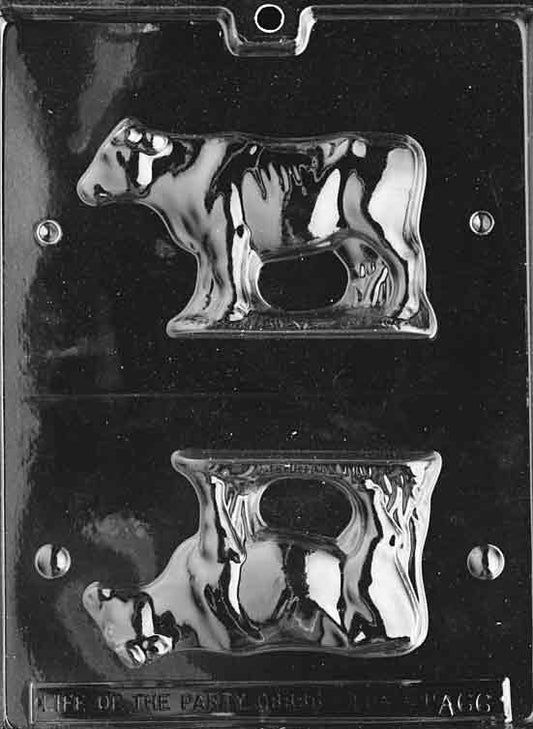 Two-part mold forming a small standing cow with horns and tail details.