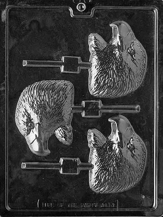 Lollipop cavity featuring an eagle head in relief with feather texture and sharp beak.