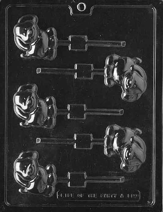 Lollipop cavity of a smiling puppy seated front-facing with floppy ears.