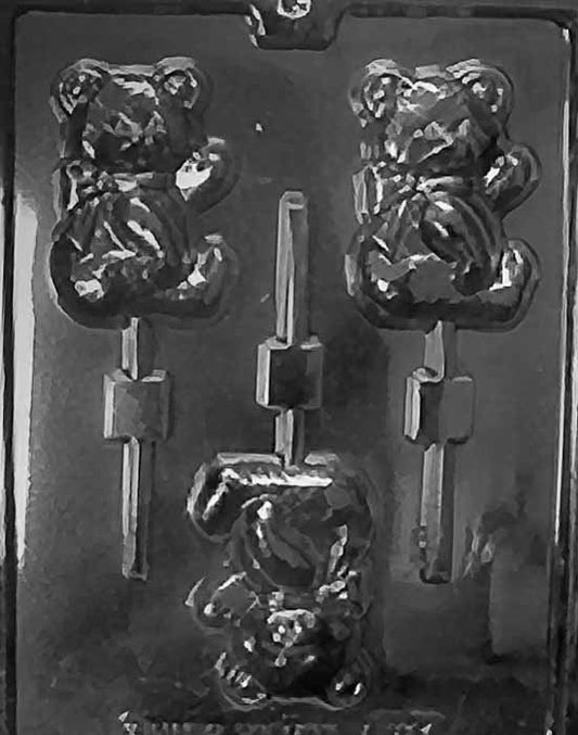 Lollipop cavity of a seated teddy bear with rounded belly and small bow detail.