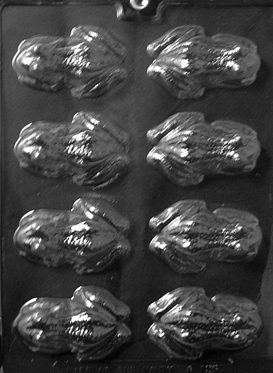 Chocolate mold cavity shaped like a plump frog with defined eyes, legs, and smooth back; semi-deep for solid pieces.