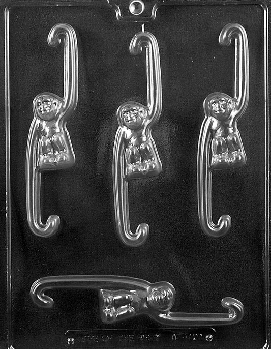 Mold sheet with monkey cavities posed as if swinging, curved tails and smiling faces.