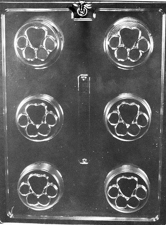 Round cavity with recessed paw print pads; thicker profile suited to cookie-style candies.