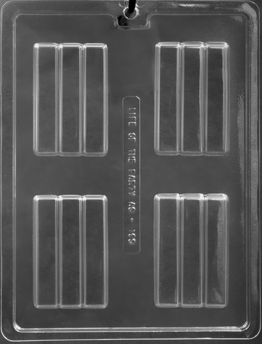 Clear plastic chocolate mold with four large rectangular cavities, each with three ridges, used for making candy bars.