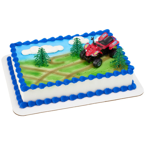 Rectangular cake decorated with an off-road ATV theme, featuring trails, trees, and a free-rolling ATV topper.