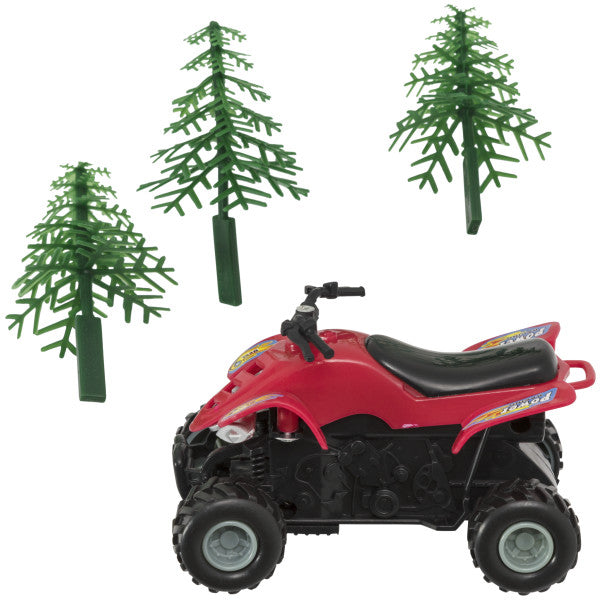 Red ATV cake topper with black wheels, alongside three green evergreen tree picks.