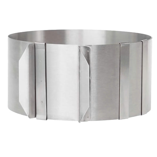 Adjustable stainless steel cake ring mold expanded into circular form, ideal for layered cakes or mousse desserts, adjusts from 6.25 to 8.5 inches.