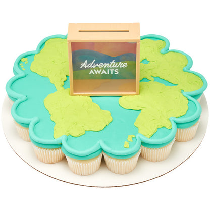 Cupcake cake shaped like a world map with the Adventure Awaits memory box topper in the center.