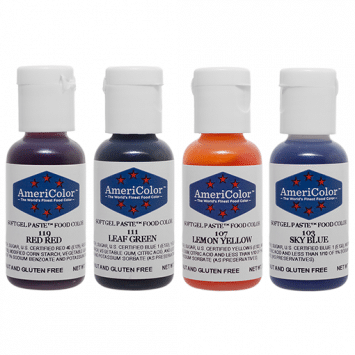 Four AmeriColor Soft Gel Paste bottles in Red Red, Leaf Green, Lemon Yellow, and Sky Blue from the 4-Color Beginner Kit, arranged side by side.