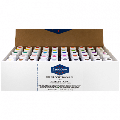 AmeriColor Nifty Fifty Kit with open box showing 50 neatly arranged Soft Gel Paste bottles, each labeled with color-coded caps for a full food color spectrum.