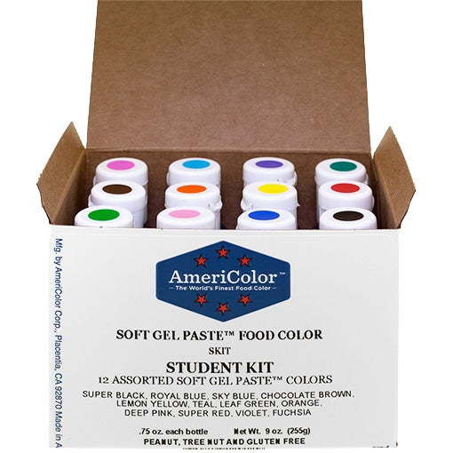 Open box of AmeriColor Soft Gel Paste Student Kit showing 12 color-coded bottles arranged neatly inside, labeled with the kit name and included shades.