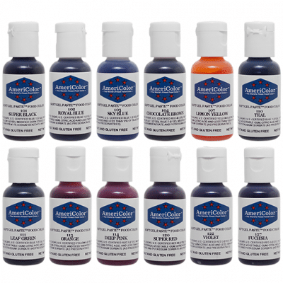 Lineup of 12 AmeriColor Soft Gel Paste bottles from the Student Kit in assorted shades including black, blues, yellow, red, pinks, green, brown, and teal.