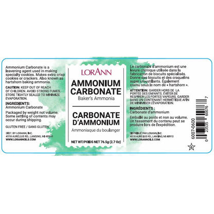 LorAnn Ammonium Carbonate label close-up with green watercolor-style background, ingredient and caution text, and net weight 2.7 oz.