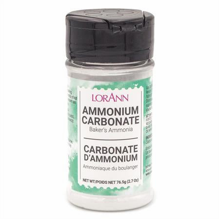 Clear plastic bottle of LorAnn Ammonium Carbonate (Baker’s Ammonia), 2.7 oz size, with black flip-top lid and green-accented label.
