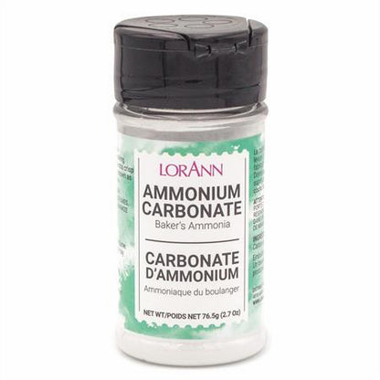 Clear plastic bottle of LorAnn Ammonium Carbonate (Baker’s Ammonia), 2.7 oz size, with black flip-top lid and green-accented label.
