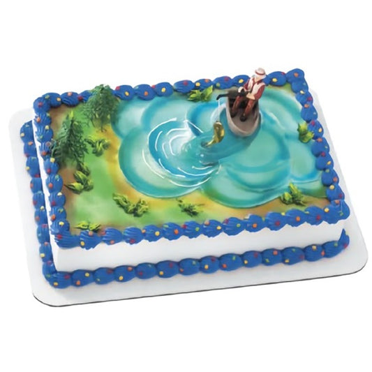 An angler fishing cake decorating kit, showcasing a fisherman in a boat on a blue fondant water surface, complete with green trees and a 'Wild Stream' sign, ideal for fishermen and nature lovers' special occasions.