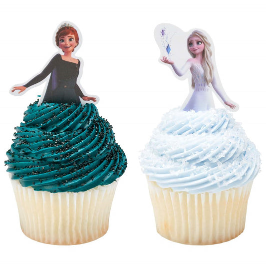 Sisters Anna and Elsa from Frozen as cupcake toppers, with Anna's fiery auburn hair and Elsa's ice-blue gown, perfect for adding a touch of sisterly love to treats, available at Lynn's Cake, Candy, and Chocolate Supplies.