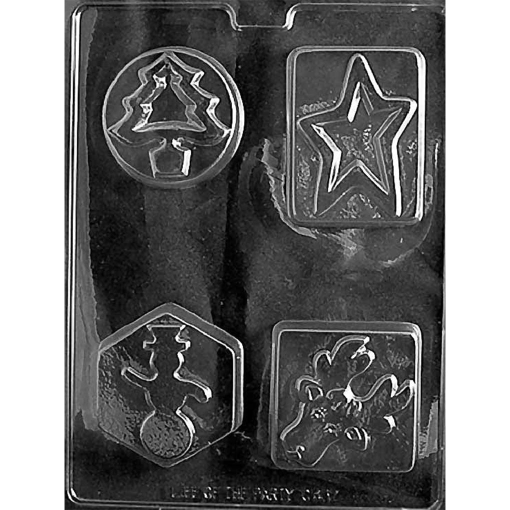 Clear plastic chocolate bar mold with four different Christmas designs, including a circular ornament with a tree, a star in a rectangle, and two festive character panels, on a dark background.
