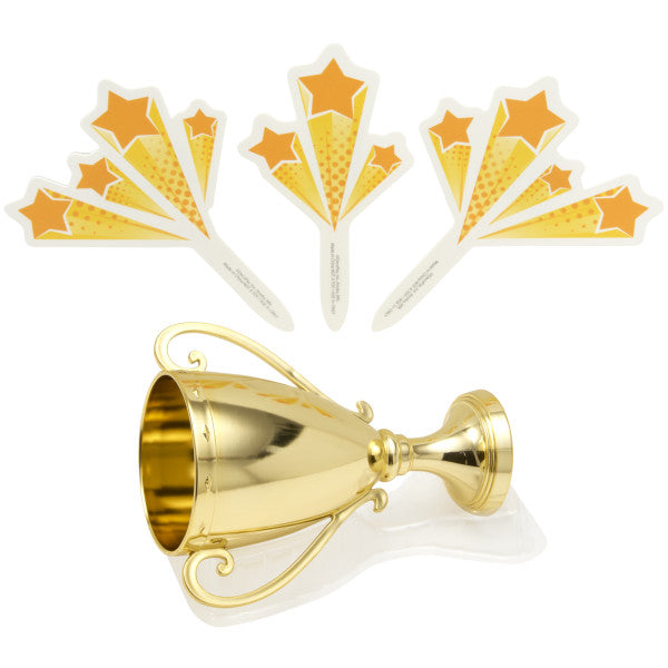 A gold trophy figurine with three starburst decorations, designed as a celebratory cake topper.