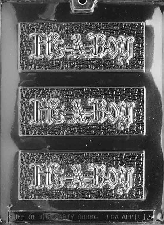 Clear bar mold with “It’s a Boy” text across a flat-faced tablet; smooth edges, white background.
