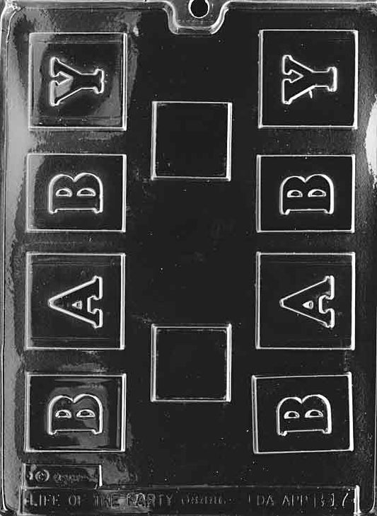 Clear mold producing a small cube with raised letters and border lines; compact scale.