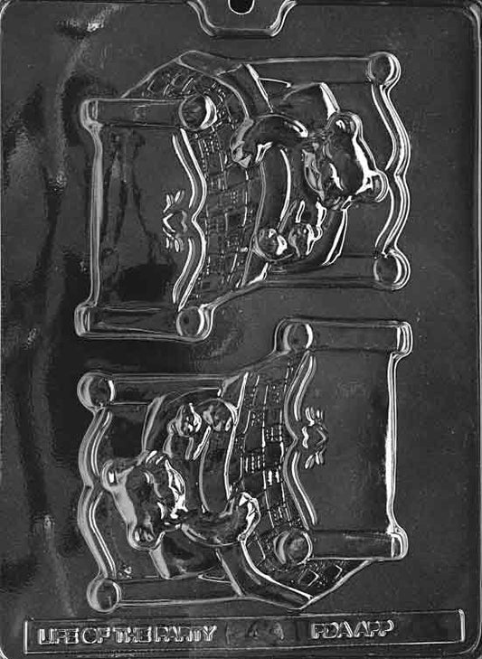 Clear plaque-style mold featuring a teddy tucked under a quilt; headboard and blanket lines embossed.