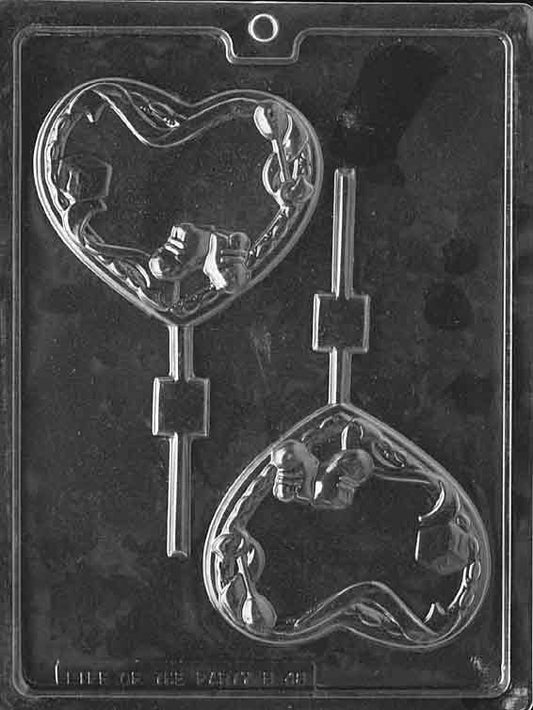 Clear lollipop mold with a plump heart cavity; smooth face and gentle curves; centered stick channel.