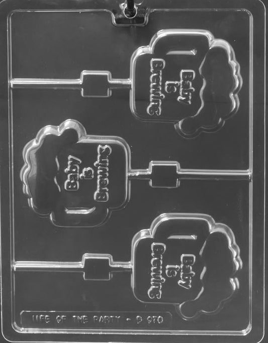 Clear lollipop mold with a celebratory “Baby Is Brewing” design; bold lettering and border; white background.