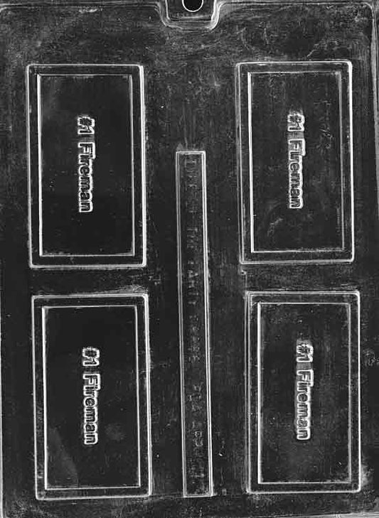Clear business-card mold with “#1 FIREMAN” raised; rectangular plaque with border; on white background.