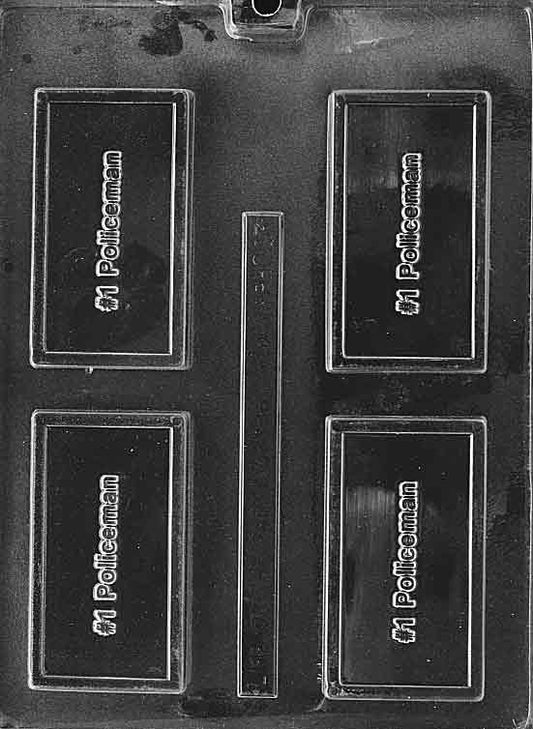 Card-sized chocolate mold with “#1 POLICEMAN” in raised letters; flat plaque with frame; white surface.