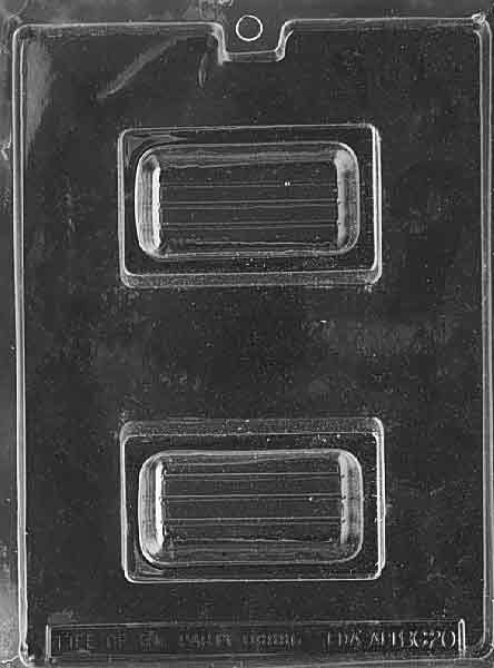 Clear mold forming a small rectangular pour box with smooth business-card style face; shallow cavity; glossy plastic on white.