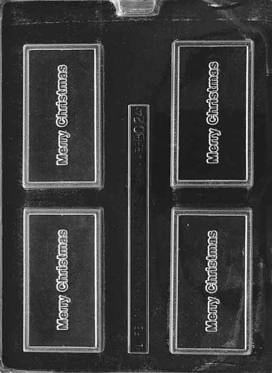 Clear chocolate mold, card-sized rectangle embossed “MERRY CHRISTMAS”; smooth border; approx. 3.75 x 2.125 in.
