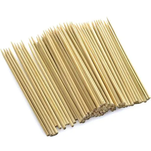 Overhead view of a 100-pack of bamboo skewers, neatly aligned with sharp ends visible.