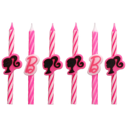 Six Barbie birthday candles arranged in a row, featuring pink and white stripes with alternating black Barbie silhouette and pink “B” decorations.