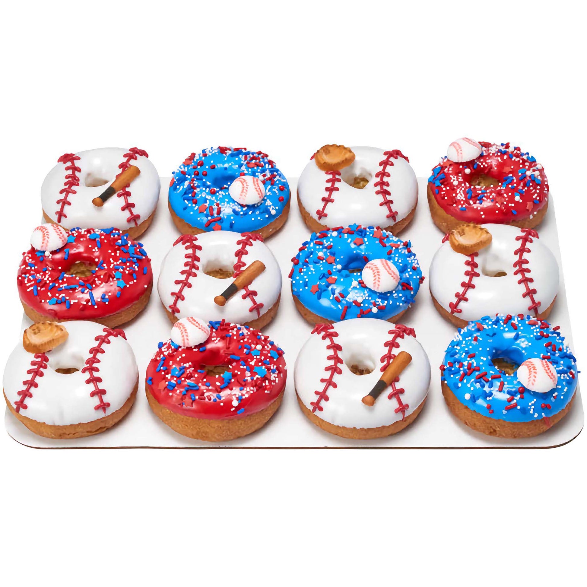 Tray of assorted donuts with red and blue frosting, decorated with baseball-themed pressed sugars including bats, gloves, and balls, sprinkled with red, white, and blue sugar.