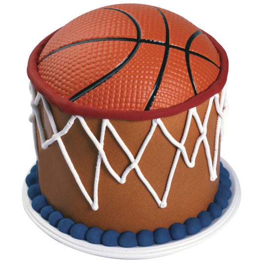 Basketball-themed cake featuring a realistic basketball topper and white piped net design around the sides.