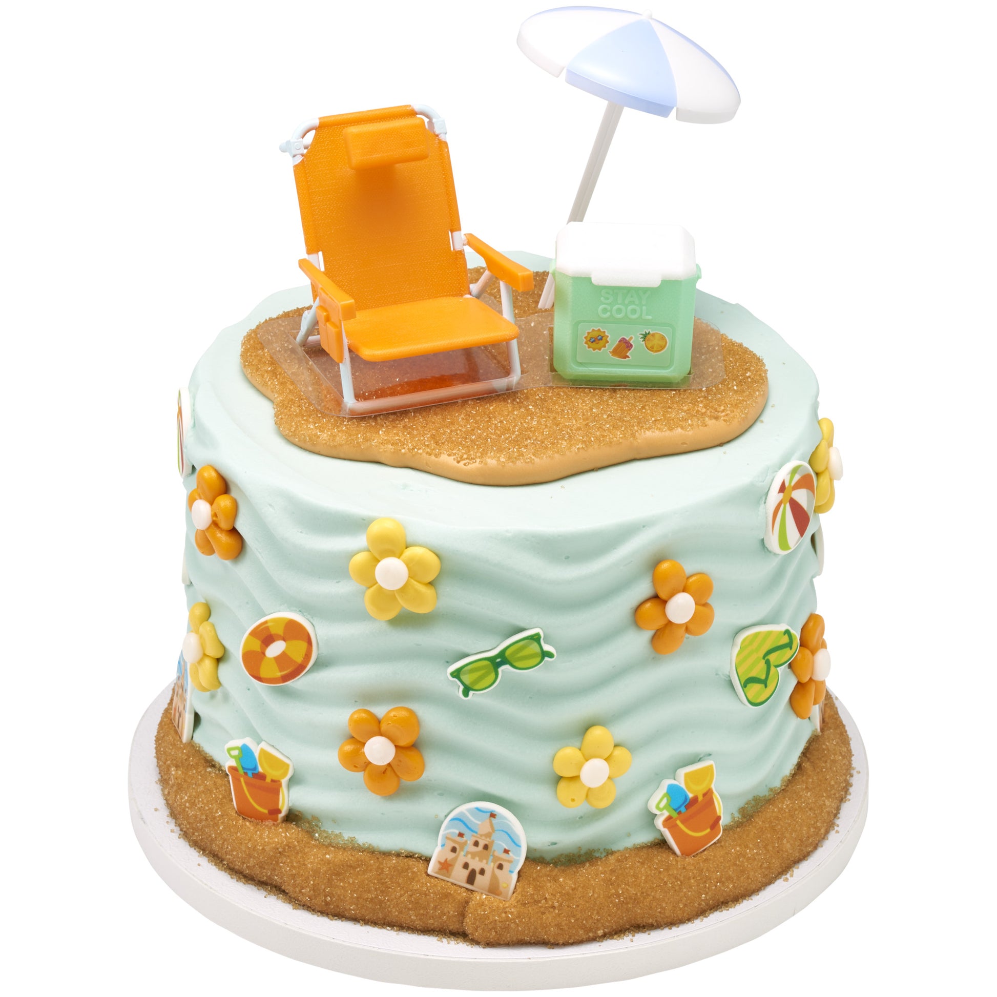 Orange beach chair, blue-and-white umbrella, and green “stay cool” cooler topper arranged on top of a light blue frosted cake with summer-themed decorations.