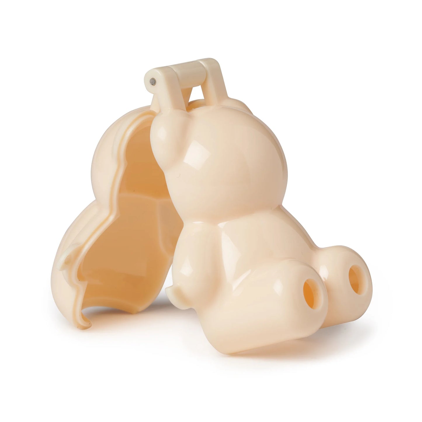 Open bear cake pop mold in beige plastic, showing two curved halves with detailed interior for shaping cake dough into a teddy bear form.