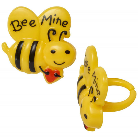 Two Bee Shaped Cupcake Rings that have Bee Mine written on them