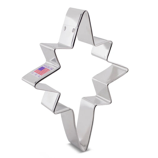 Metal Bethlehem Star cookie cutter with sharp, zig-zag edges and a Made in USA sticker.