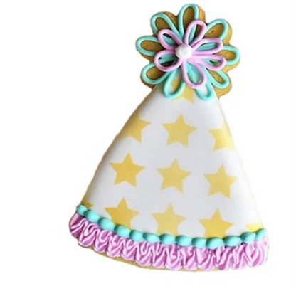 Birthday Hat cookie cutter next to a decorated birthday hat cookie with star pattern and piped frosting details.