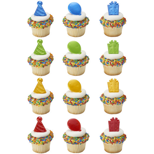 Cupcakes decorated with multicolor sprinkles and topped with party-themed rings in bright primary colors