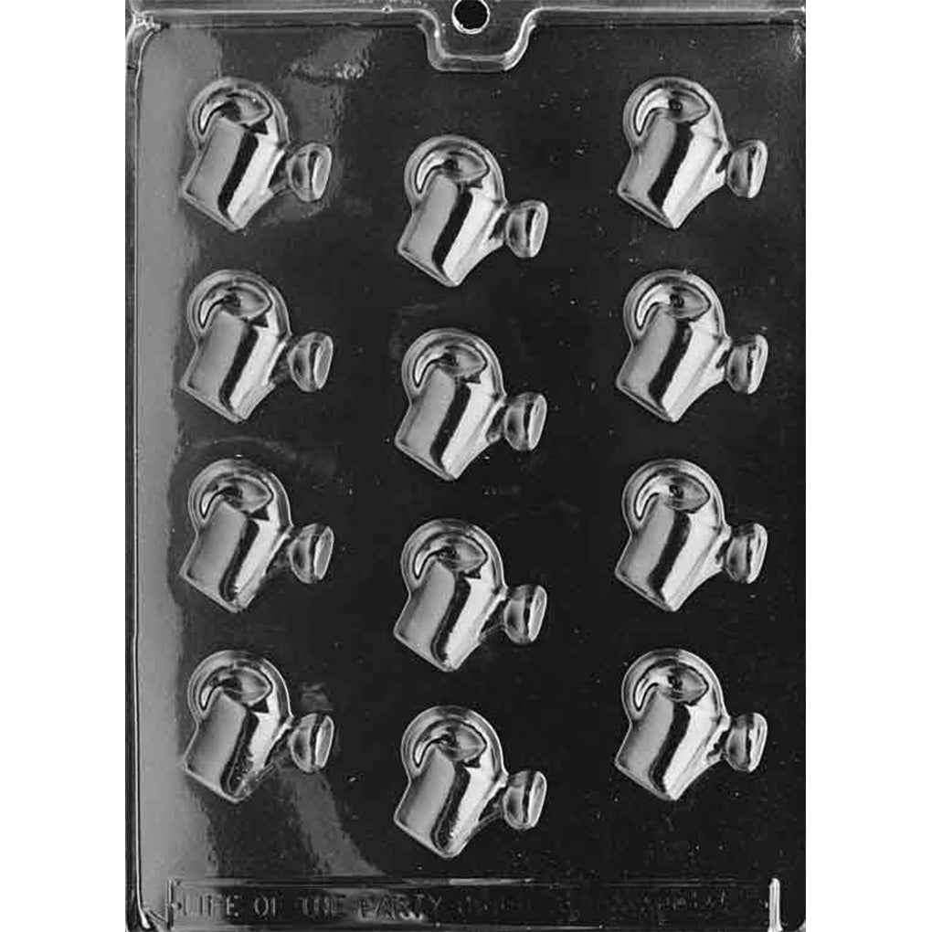 Clear plastic chocolate mold photographed on a black background with multiple small watering can–shaped cavities, each showing a rounded can body, curved handle, and spout.