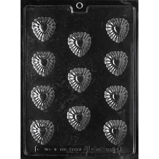 Clear plastic chocolate mold designed for making bite-size fancy heart-shaped chocolates, featuring twelve compartments arranged in four rows of three. Each compartment is intricately designed with a heart shape surrounded by decorative fluted edges, resembling a floral pattern. The mold is set against a black background to highlight the detailed design of each heart. This mold is perfect for crafting elegant, bite-sized chocolates for weddings, Valentine's Day, or special gifts.