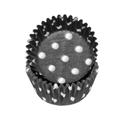 Black mini cupcake liner with white polka dots, stacked for display

