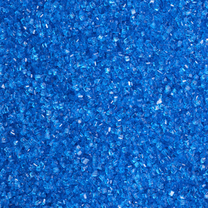 Close-up of bright blue sanding sugar showing coarse, translucent blue sugar crystals with sparkling, faceted surfaces and vivid blue color.