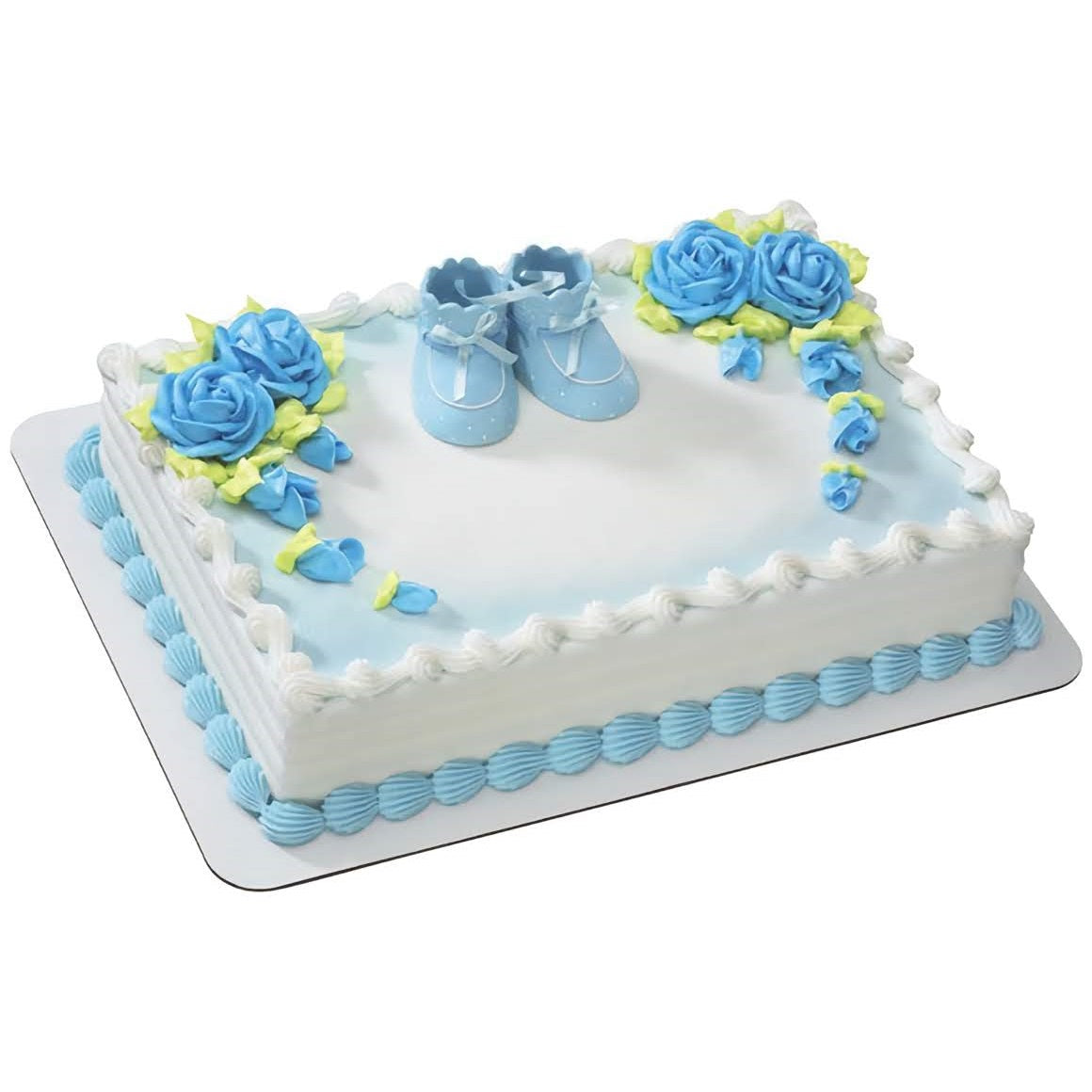 Elegant baby shower cake with blue booties topper and blue and yellow floral decorations, ideal for celebrating a new baby boy.