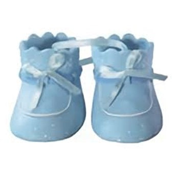 Close-up of baby blue booties cake decoration, dotted with white, perfect for baby boy shower cakes and pastry displays.
