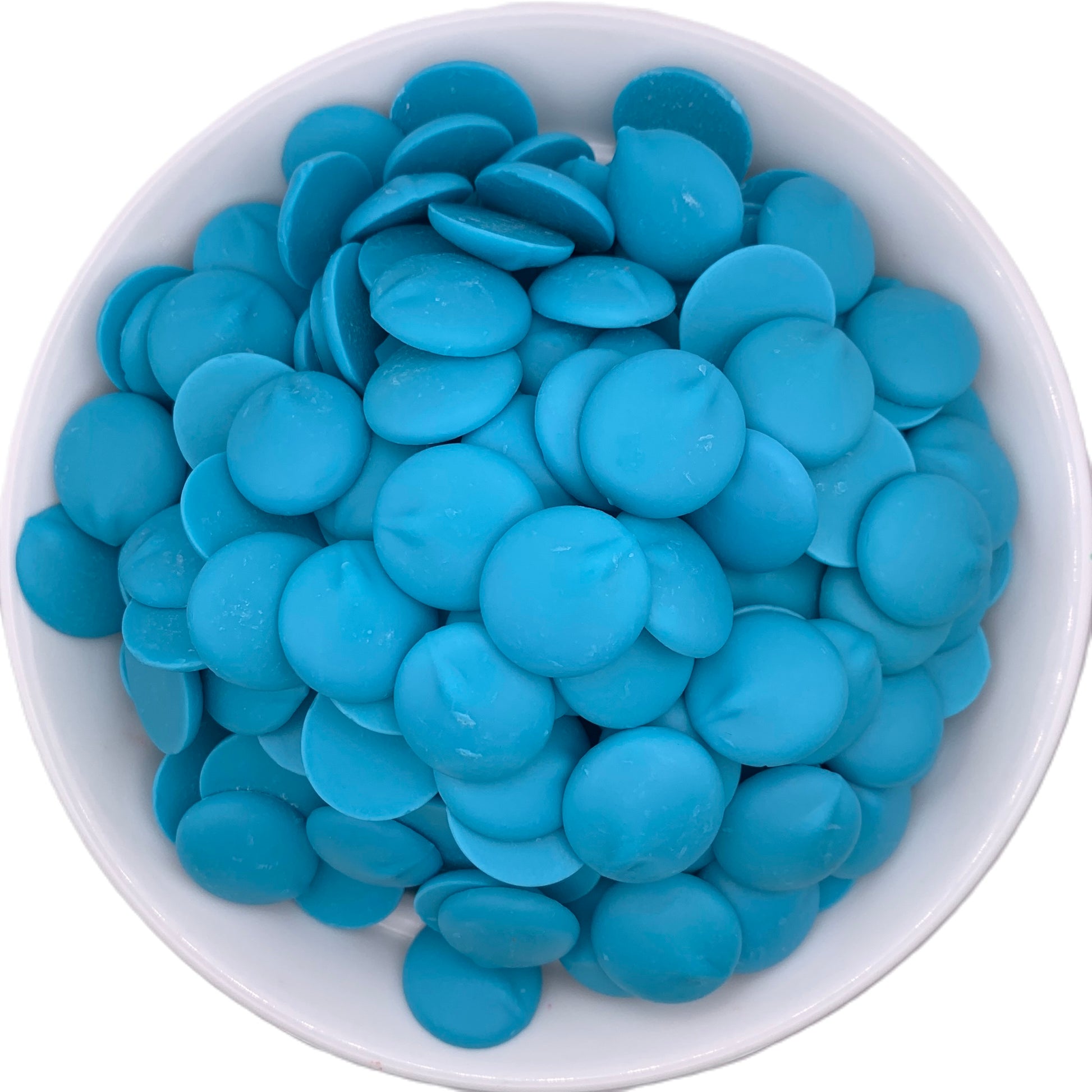 Overhead view of a white bowl filled with Merckens blue chocolate melting wafers, showing a bright sky blue color, perfect for creating ocean-themed treats or adding a splash of color to party confections.